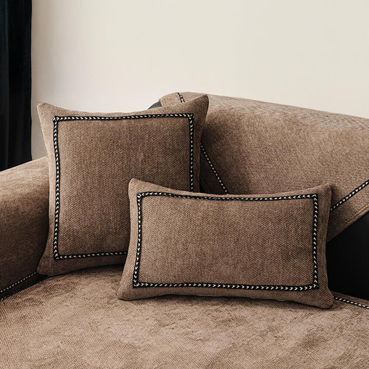 Full shot of a living room with a modern jacquard chenille couch cover, transforming the sofa's appearance