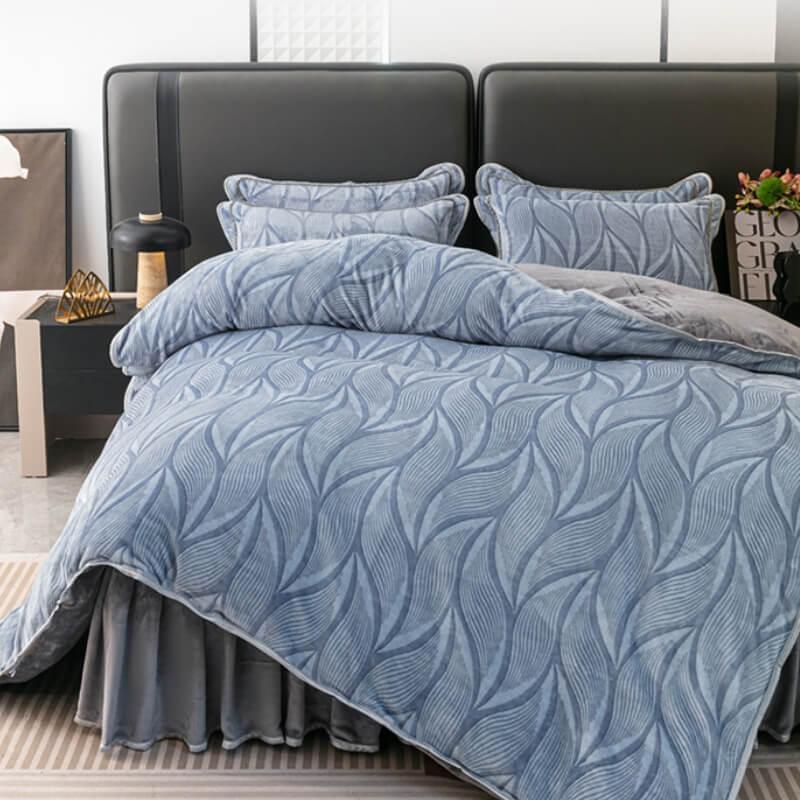 Close-up of modern leaf pattern on plush velvet bedding set, includes duvet cover & skirt.