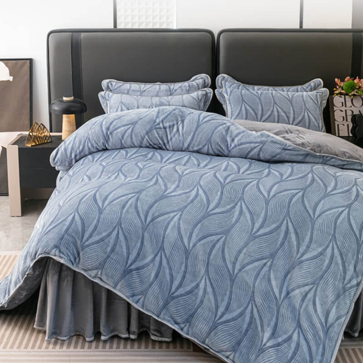 Close-up of modern leaf pattern on plush velvet bedding set, includes duvet cover & skirt.