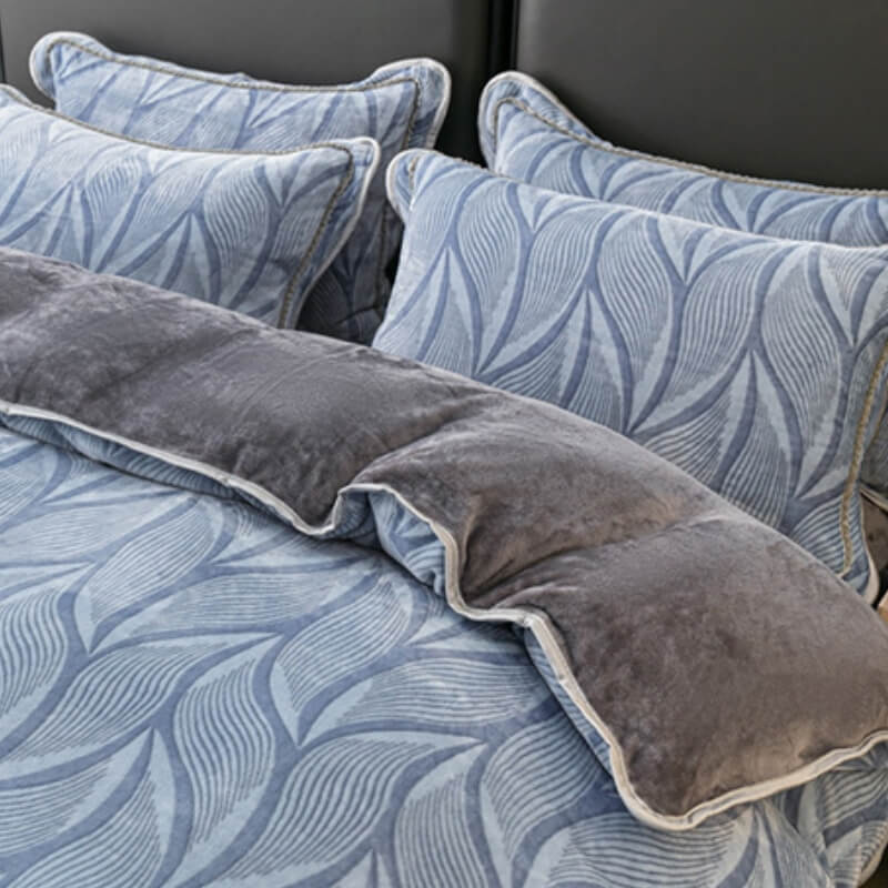 Modern leaf pattern velvet duvet cover from a bedding set, displayed on a stylish bed.