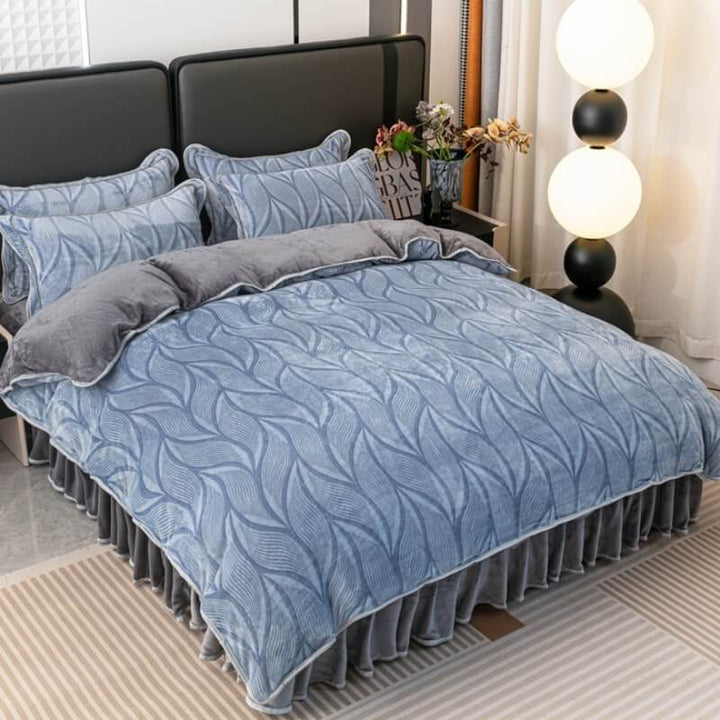 Bedroom decorated with a modern leaf pattern velvet bedding set and coordinating bed skirt.