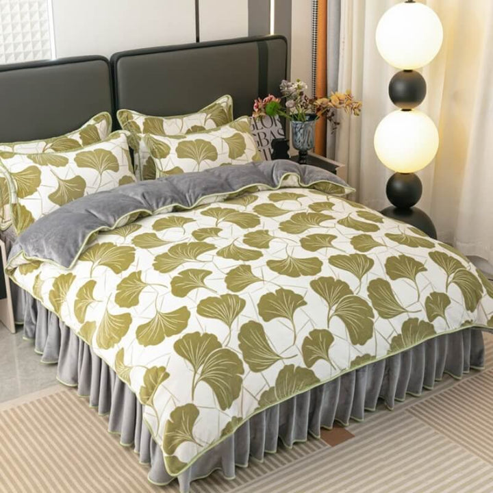 Detail of the soft velvet texture and modern leaf pattern on a new bedding set.