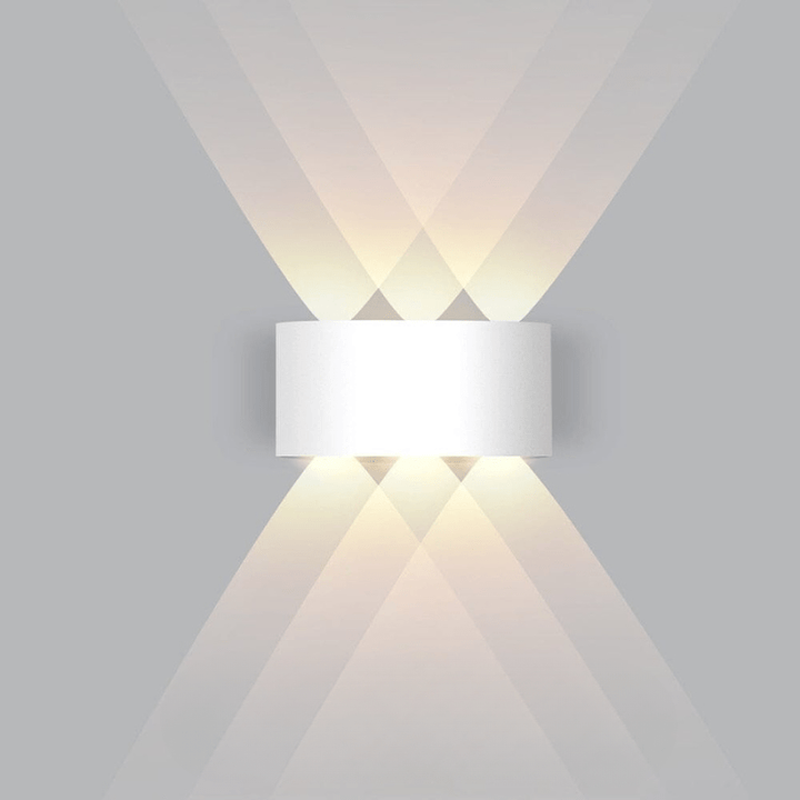 Contemporary LED wall-mounted lamp, provides bright, energy-saving outdoor lighting.