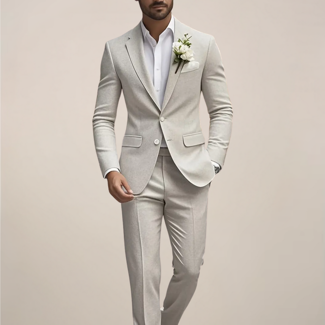 Modern men's slim fit cream wedding suit for grooms. Stylish two-piece formal wear, perfect for urban or summer weddings.