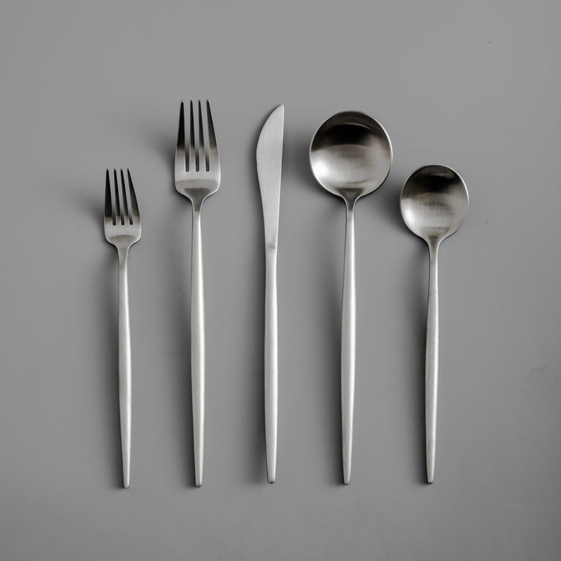 Minimalist tableware set with a matte black finish and pure design. Kitchen essential.