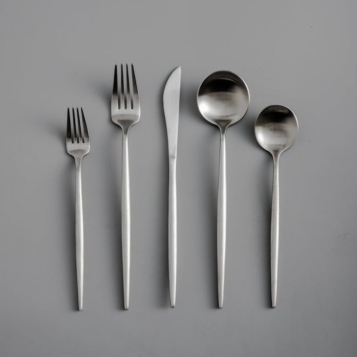 Minimalist tableware set with a matte black finish and pure design. Kitchen essential.