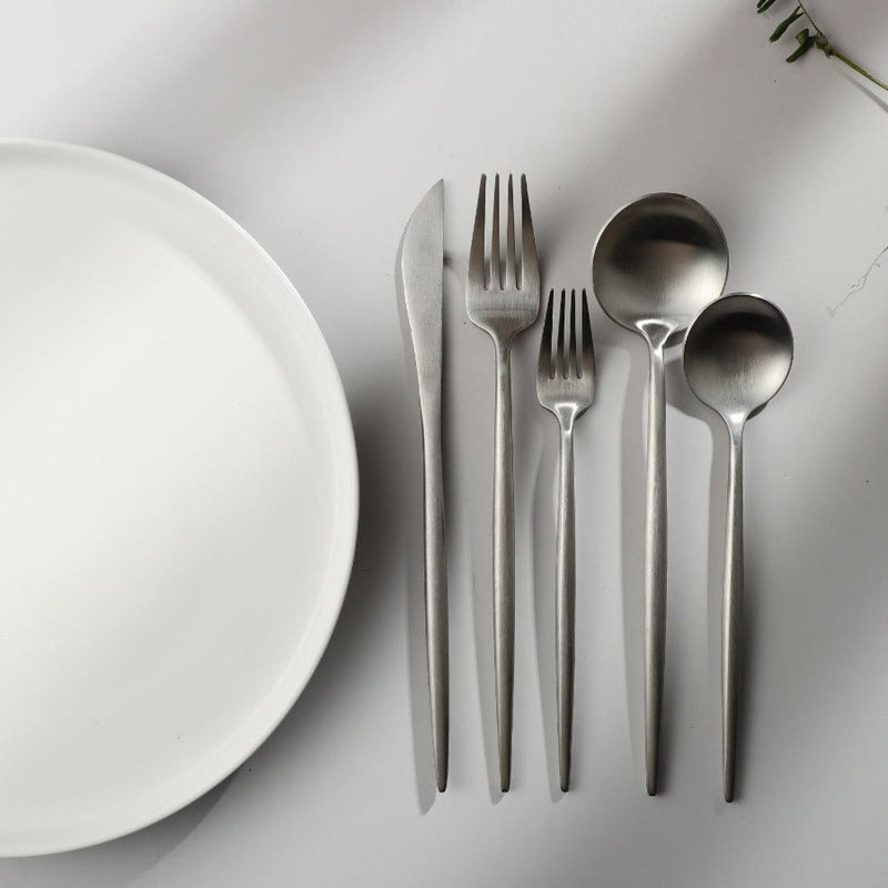 Matte black elegant cutlery set for sophisticated table presentation. Kitchenware.