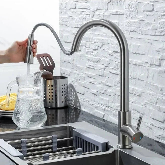 Stainless steel smart kitchen faucet with pull-down sprayer, motion sensor for hygienic use.