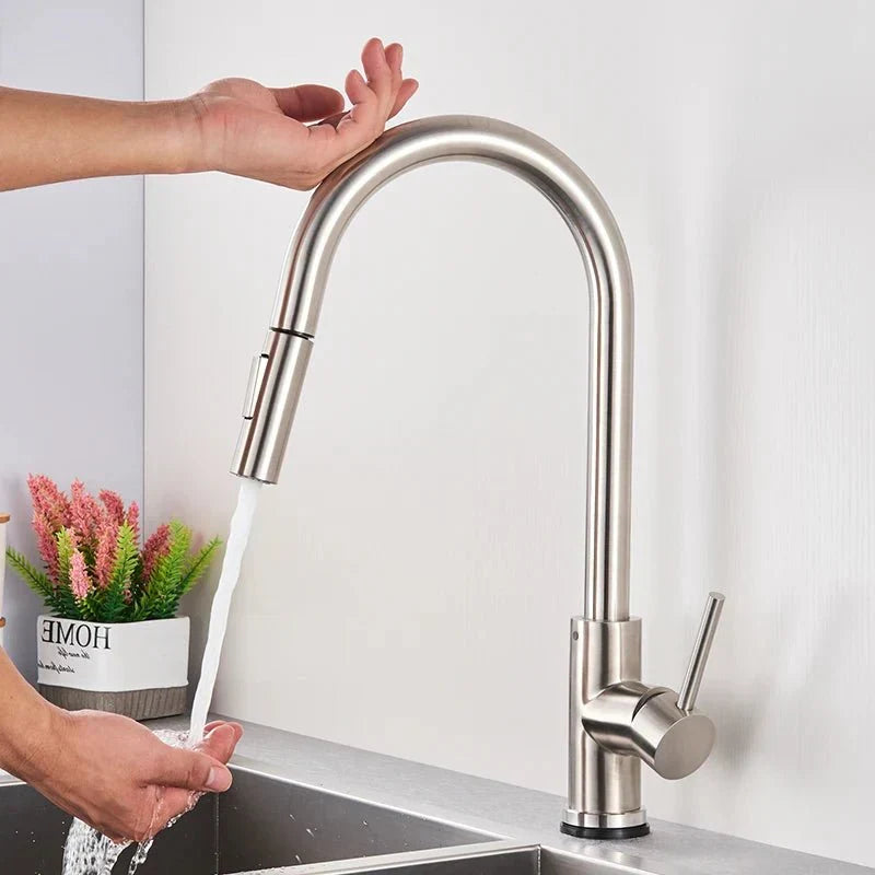 Black touchless sensor kitchen faucet, sleek design with handy pull-out sprayer for sink tasks.