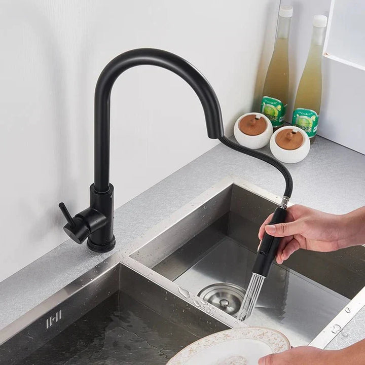 Contemporary smart kitchen faucet, silver finish, featuring an intuitive sensor and flexible pull-out sprayer.