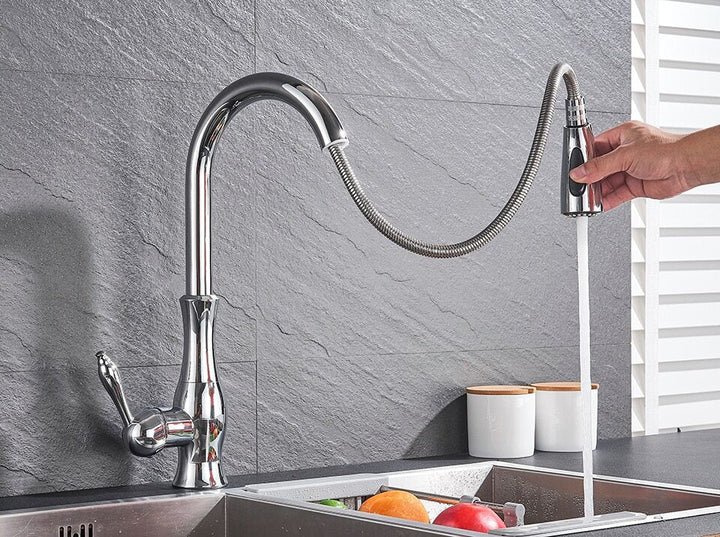 Chromium pull-out kitchen faucet, modern design. FlexFlow tap for efficient cleaning of kitchen sinks.