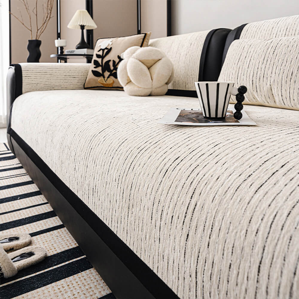 Modern striped chenille couch cover for sofa protection, view from above, non-slip design