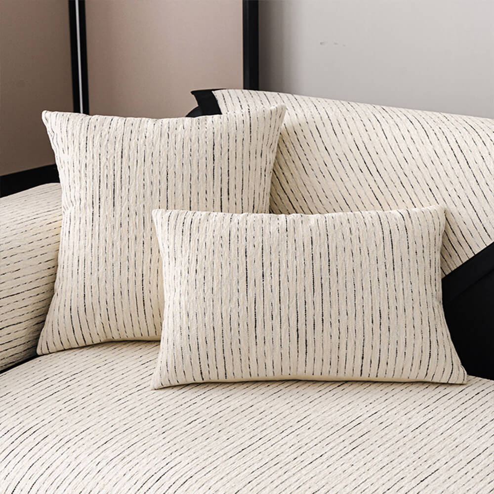 Lifestyle shot of a living room with a striped chenille couch cover, enhancing home decor