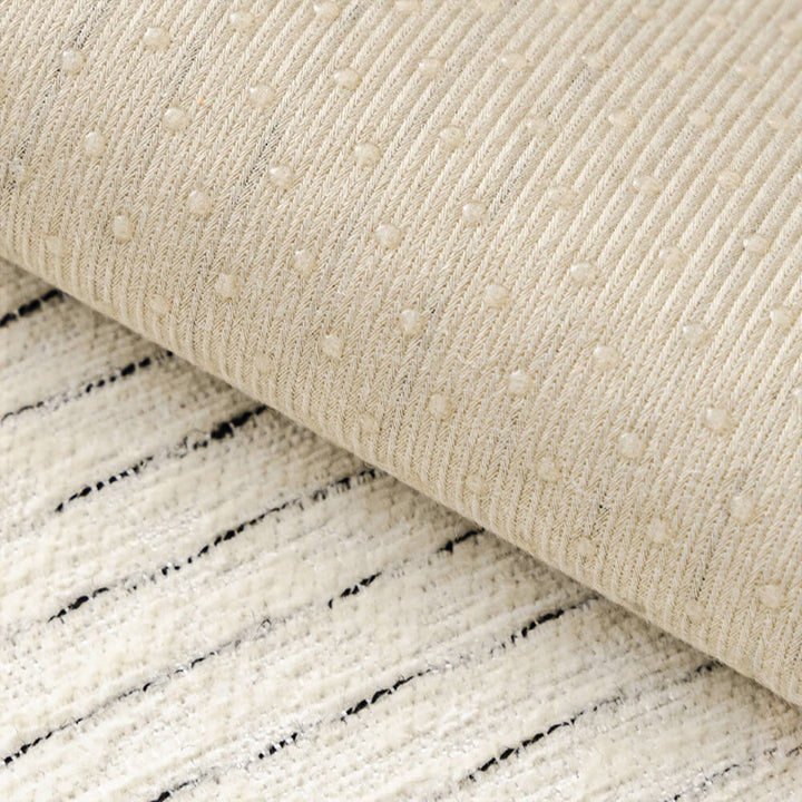 Folded striped chenille sofa cover, highlighting its soft texture and quality material