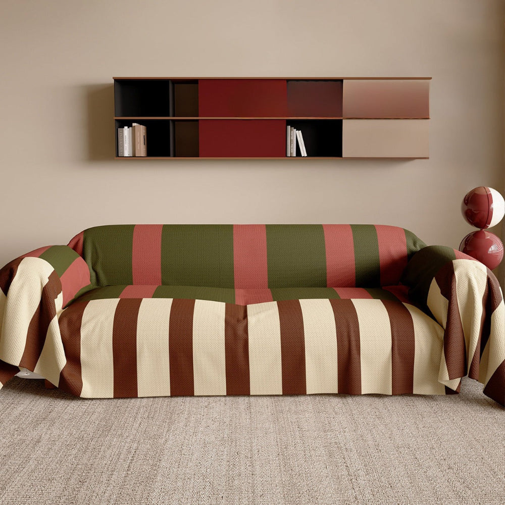 Pet friendly grey and white striped couch throw draped over a sofa in a modern living room.