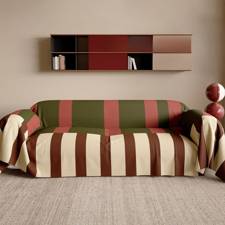 Pet friendly grey and white striped couch throw draped over a sofa in a modern living room.