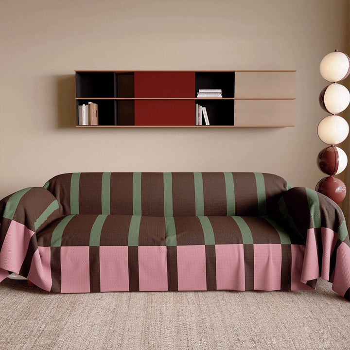 Close-up of a modern striped sofa cover fabric, highlighting the geometric pattern and texture.