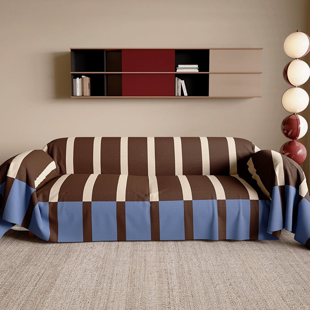 Stylish striped sofa cover in a contemporary home setting, offering furniture protection and decor.