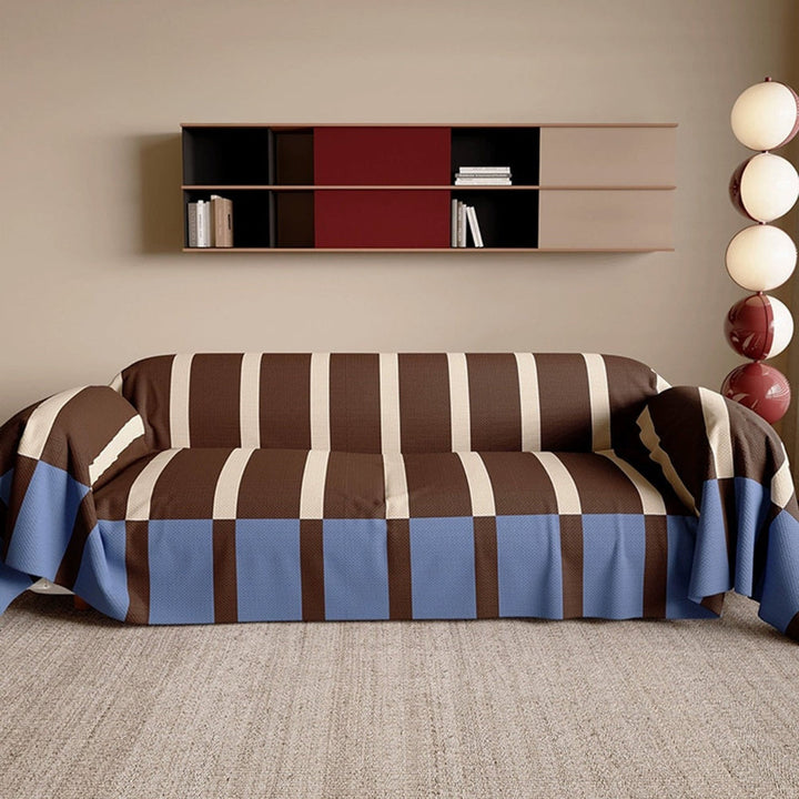 Stylish striped sofa cover in a contemporary home setting, offering furniture protection and decor.