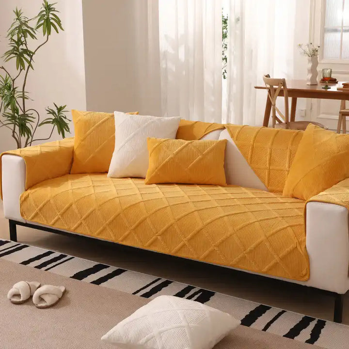 Velvet plush couch cover draped over a sofa, showing its elegant modern home aesthetic