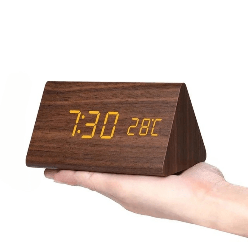 Natural wood-look digital clock with LED display and hands-free voice activation, modern design.