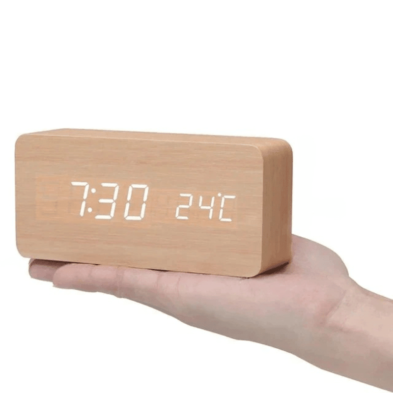 Bedroom smart clock: voice-activated digital LED display in a stylish wooden minimalist design.