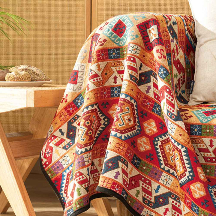Bohemian jacquard couch cover and throw blanket, perfect for adding warmth and style to any room.