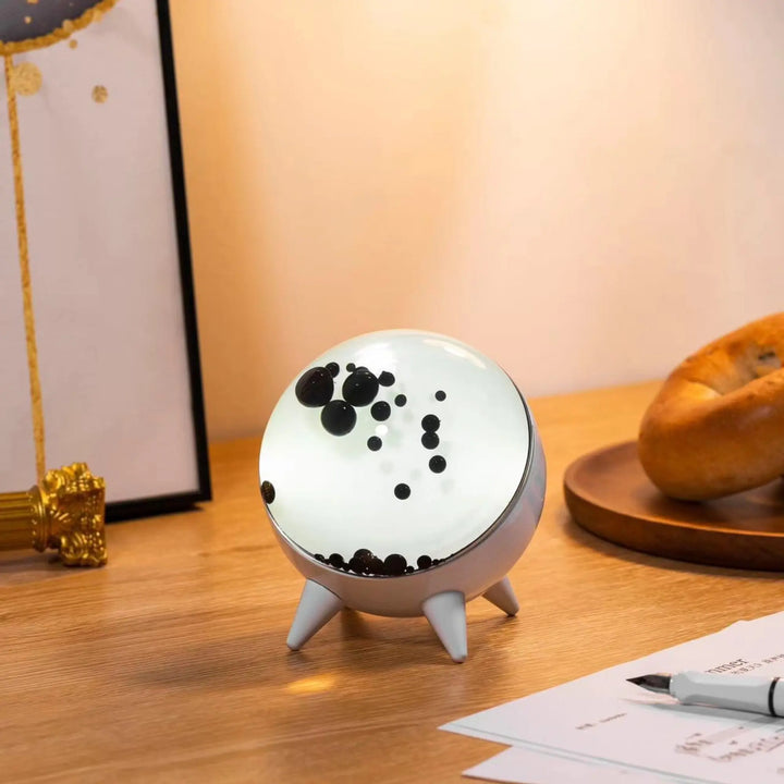 Ferrofluid display with dynamic visuals, music-reactive LED lights, and a Bluetooth speaker for sensory decor.