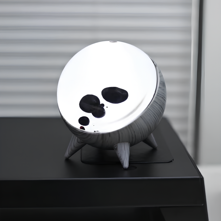 Ferrofluid display with music-reactive visuals, a Bluetooth speaker, and LED lights for interactive home art.