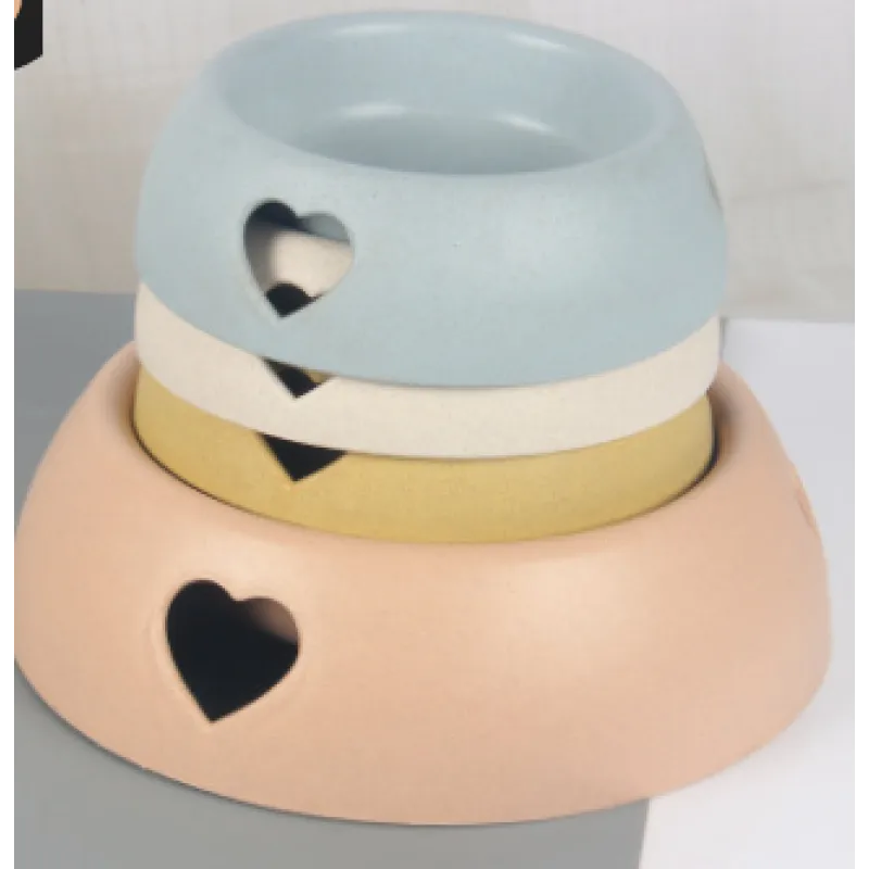 Natural bamboo pet feeding bowl with cute heart design, perfect for small dogs or cats.