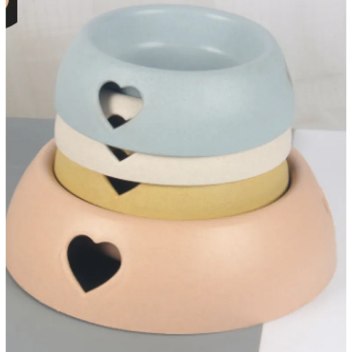 Natural bamboo pet feeding bowl with cute heart design, perfect for small dogs or cats.