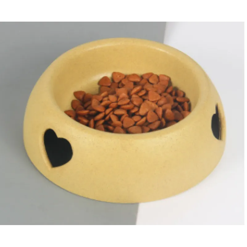 Eco-friendly pet food bowl made from natural material, featuring a charming heart accent.