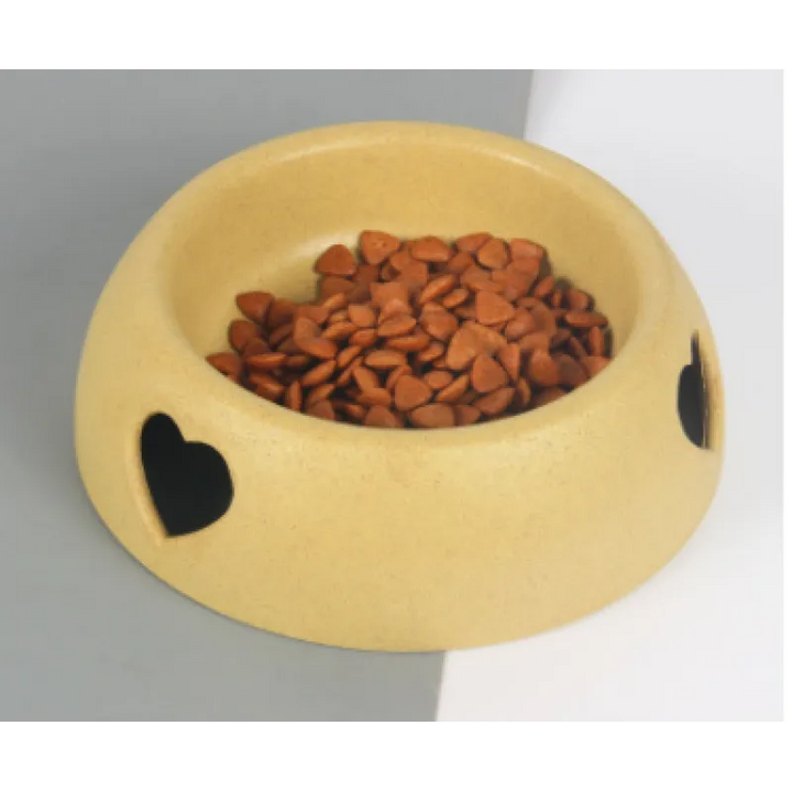 Eco-friendly pet food bowl made from natural material, featuring a charming heart accent.