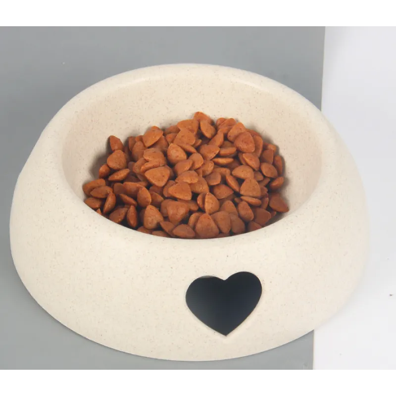 Heart-shaped design pet feeding bowl in natural wood finish, ideal for health-conscious pet owners.
