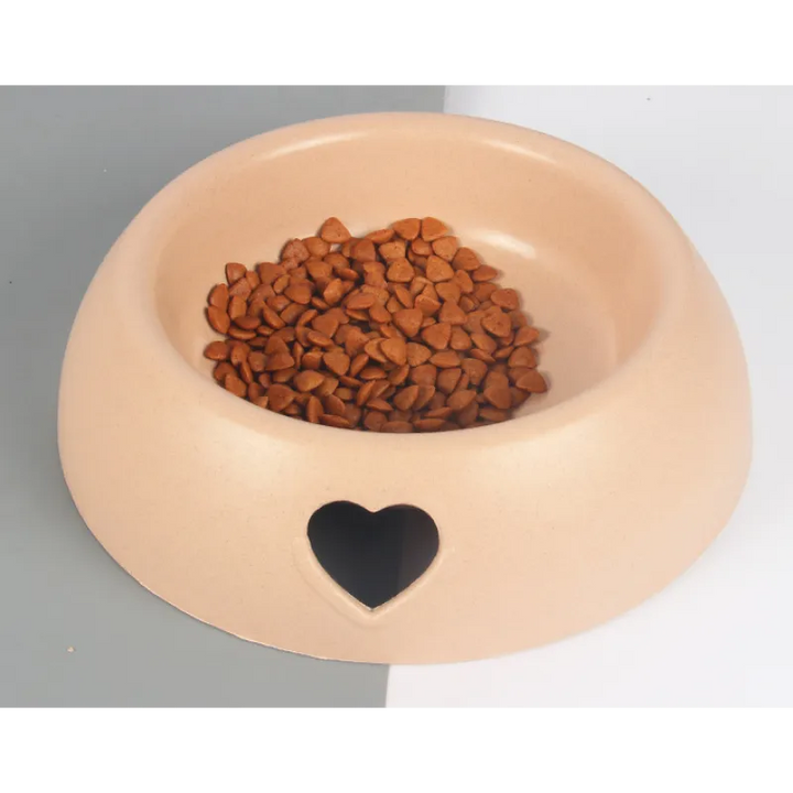 Pet care accessory: a chic natural material bowl with an adorable heart, enhancing your pet's mealtime.