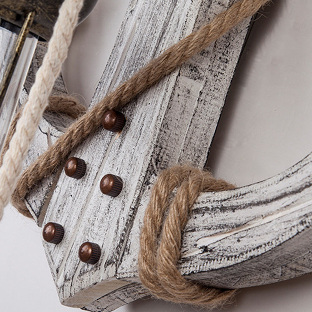 Nautical Anchor LED Wall Sconce featuring rustic wood & iron. Lantern-like glow, perfect for coastal home lighting.
