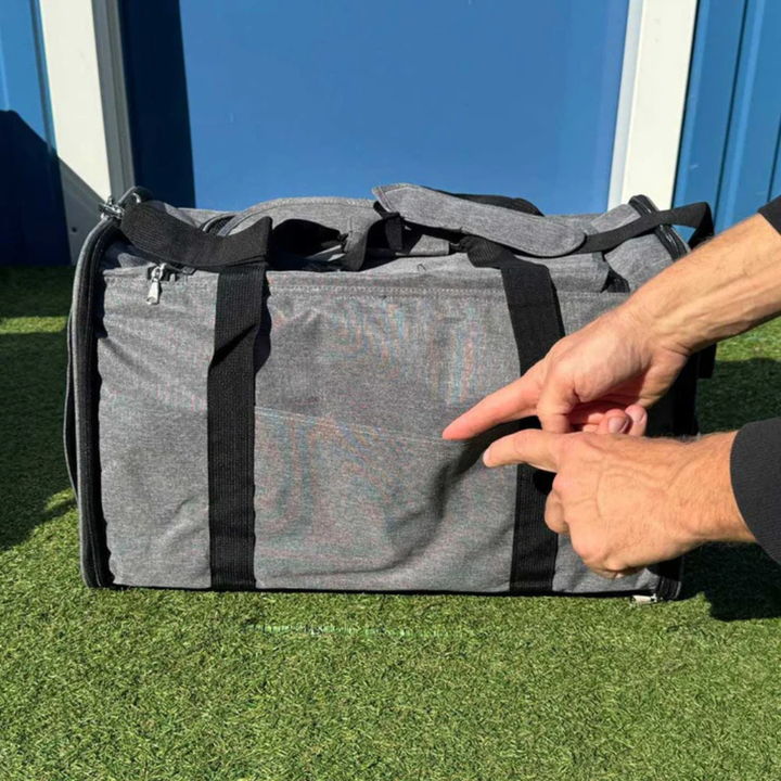 Portable pet transport carrier featuring soft sides and ample space for small pets, 50x32x32cm.
