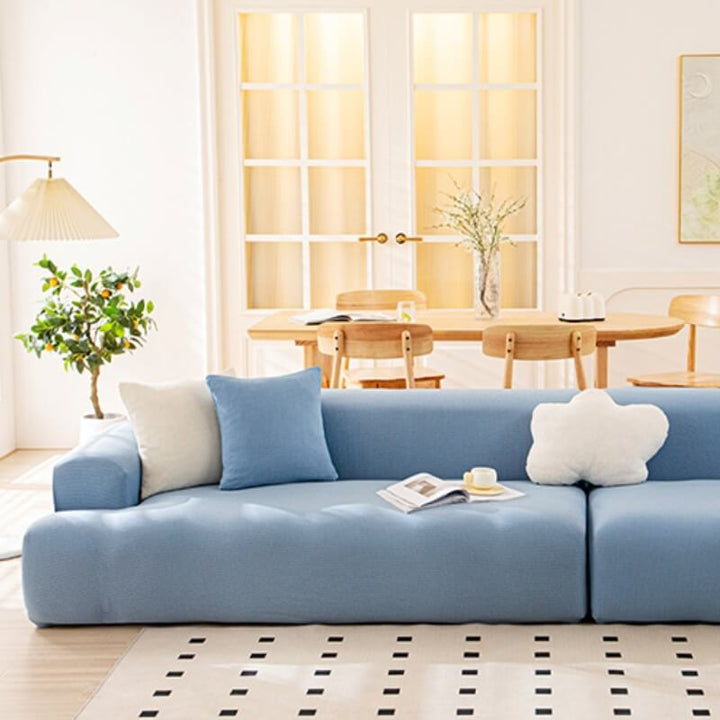Textured pattern on a blue waterproof couch cover, offering both protection and style