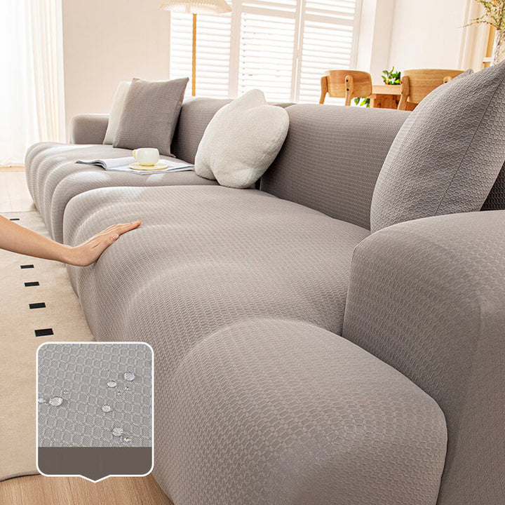 Side profile of a couch demonstrating how the stretchy waterproof cover fully protects upholstery