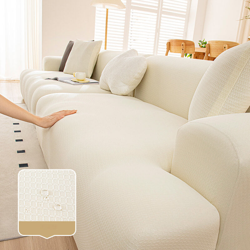 Packaging of a pet-friendly anti-scratch sofa cover, highlighting its waterproof qualities