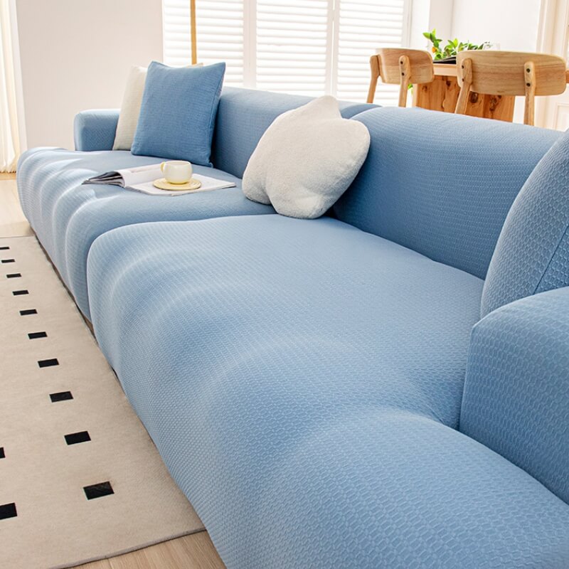 Close-up of flexible, waterproof fabric of an anti-scratch sofa cover, ideal for pet owners