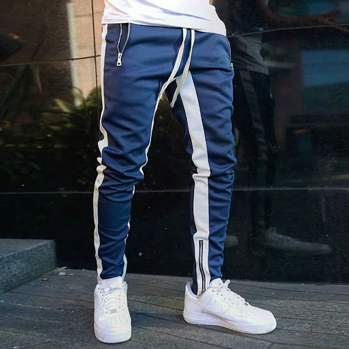 Men's striped FlexStride joggers with zipper pockets. Ideal athletic wear & stretch pants for everyday.