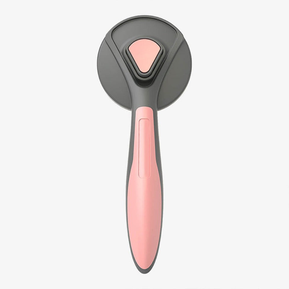 Close-up of a new pet deshedding comb, highlighting its easy-clean mechanism for dogs and cats.