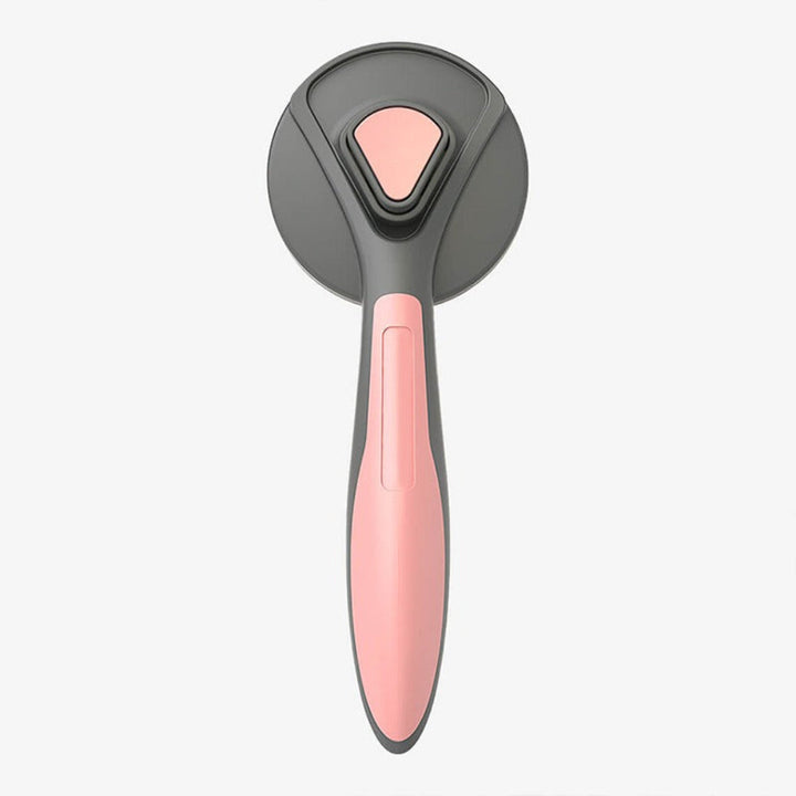Close-up of a new pet deshedding comb, highlighting its easy-clean mechanism for dogs and cats.