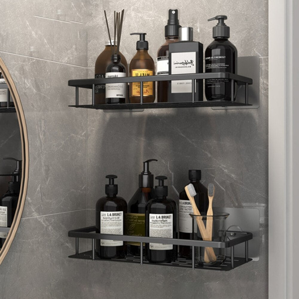 Black metal wall-mounted shelf with suction cups, designed for clutter-free bathroom organization.