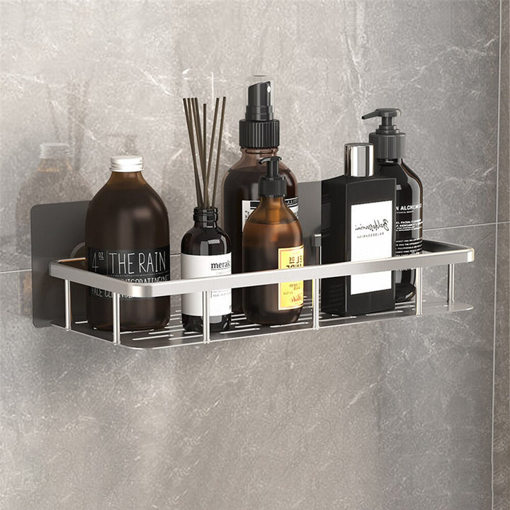 Durable metal wall shelf for bathroom, uses strong suction cups for no-drill installation.