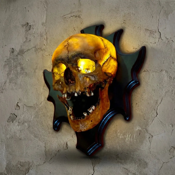 Close-up of the resin Eerie Wall Mounted Skull Lamp, perfect for gothic decor, Halloween, or haunted house lighting.