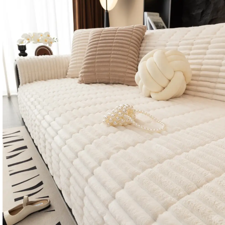 Close-up of soft flannel sofa cover texture with visible non-slip backing, pet friendly furniture protector.