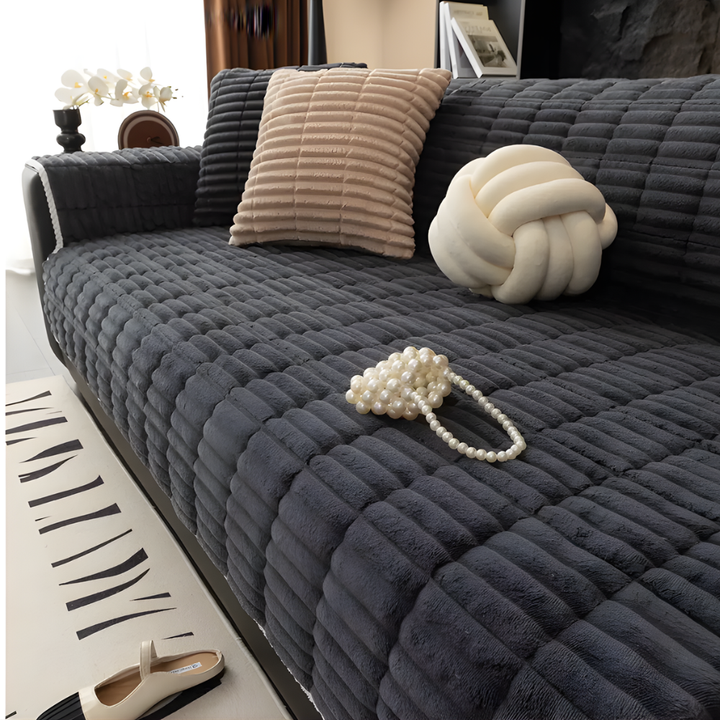 Stylish flannel furniture protector with non-slip backing, perfect for pet-friendly living room sofas.