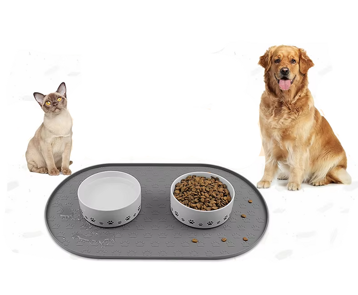 Non-slip silicone feeding mat for dogs, grey, with raised edges to prevent spills, easy to clean pet accessory.